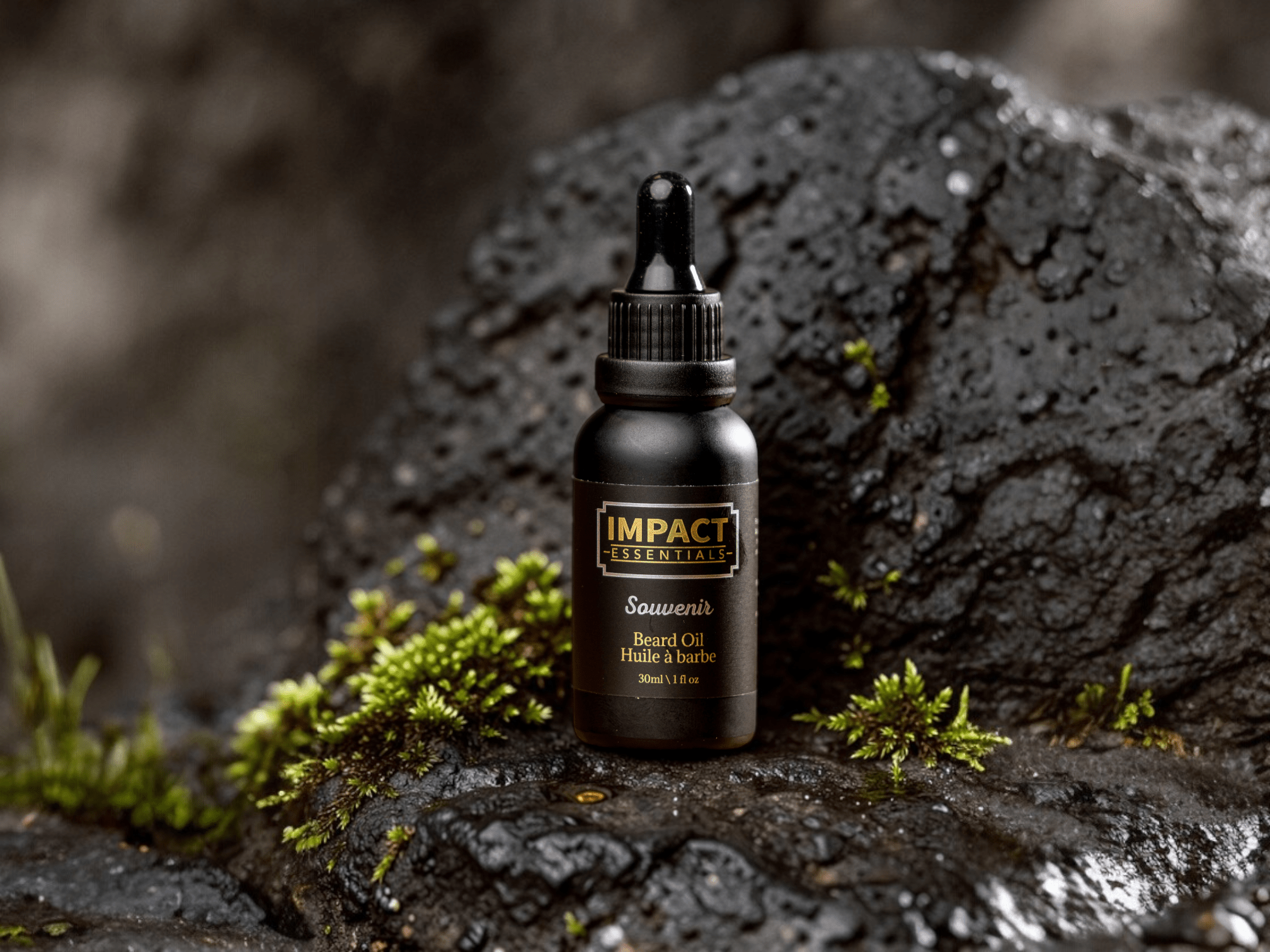 A man in a professional setting maintaining his beard with IMPACT Essentials spring grooming products.