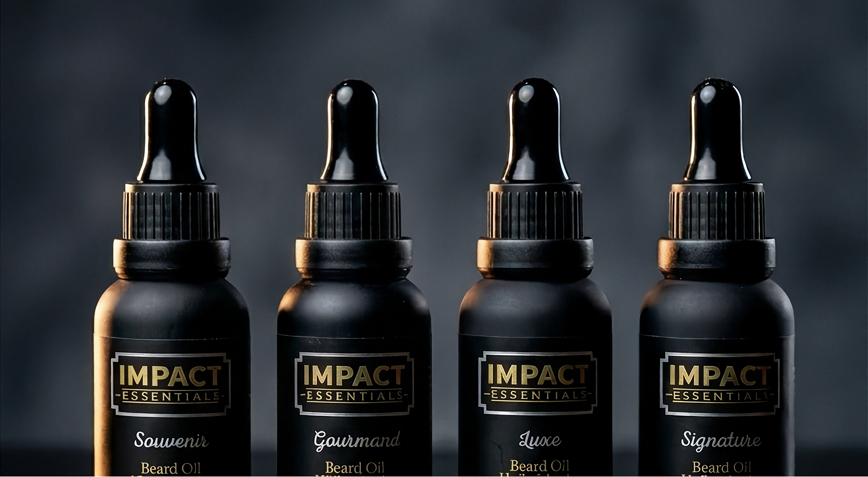 Four black bottles of Impact Essentials beard oil on a dark background