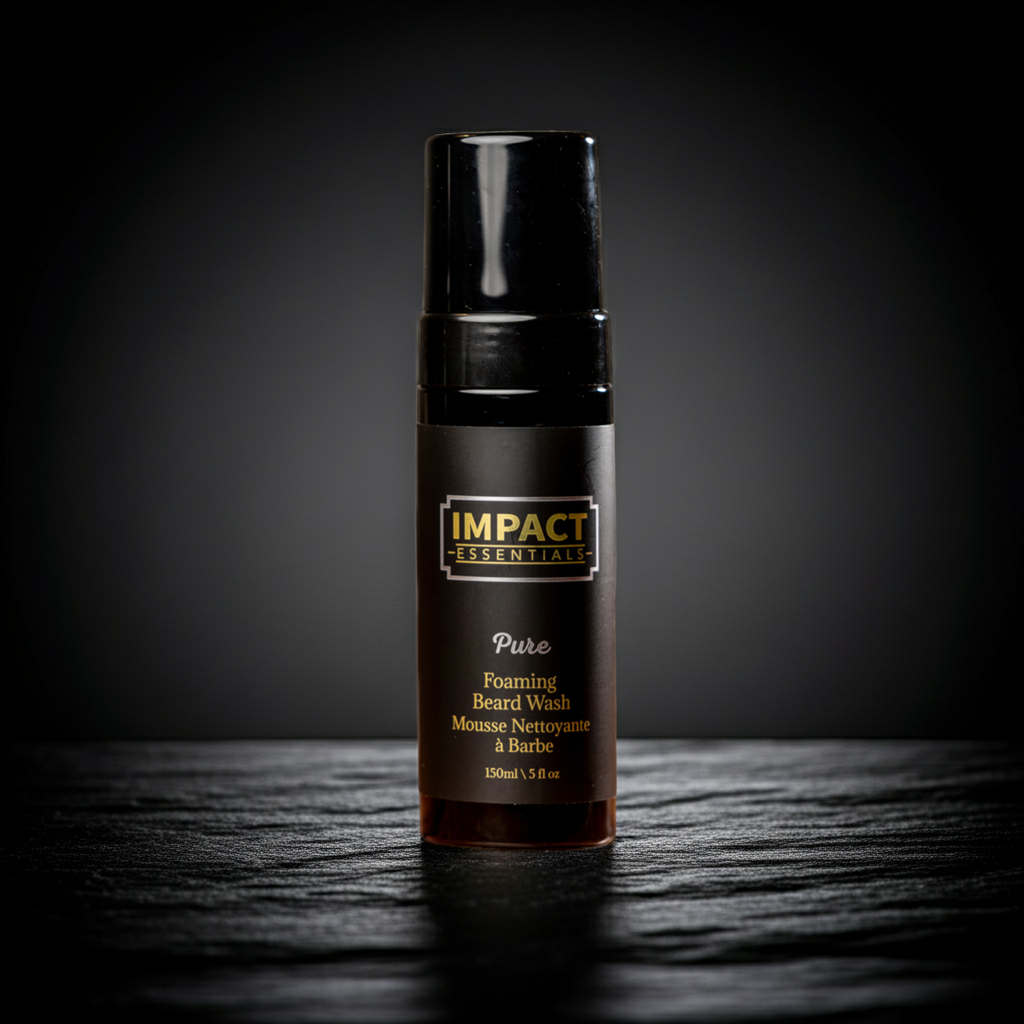 Black bottle of Impact Essentials Pure Foaming Beard Wash on a dark background