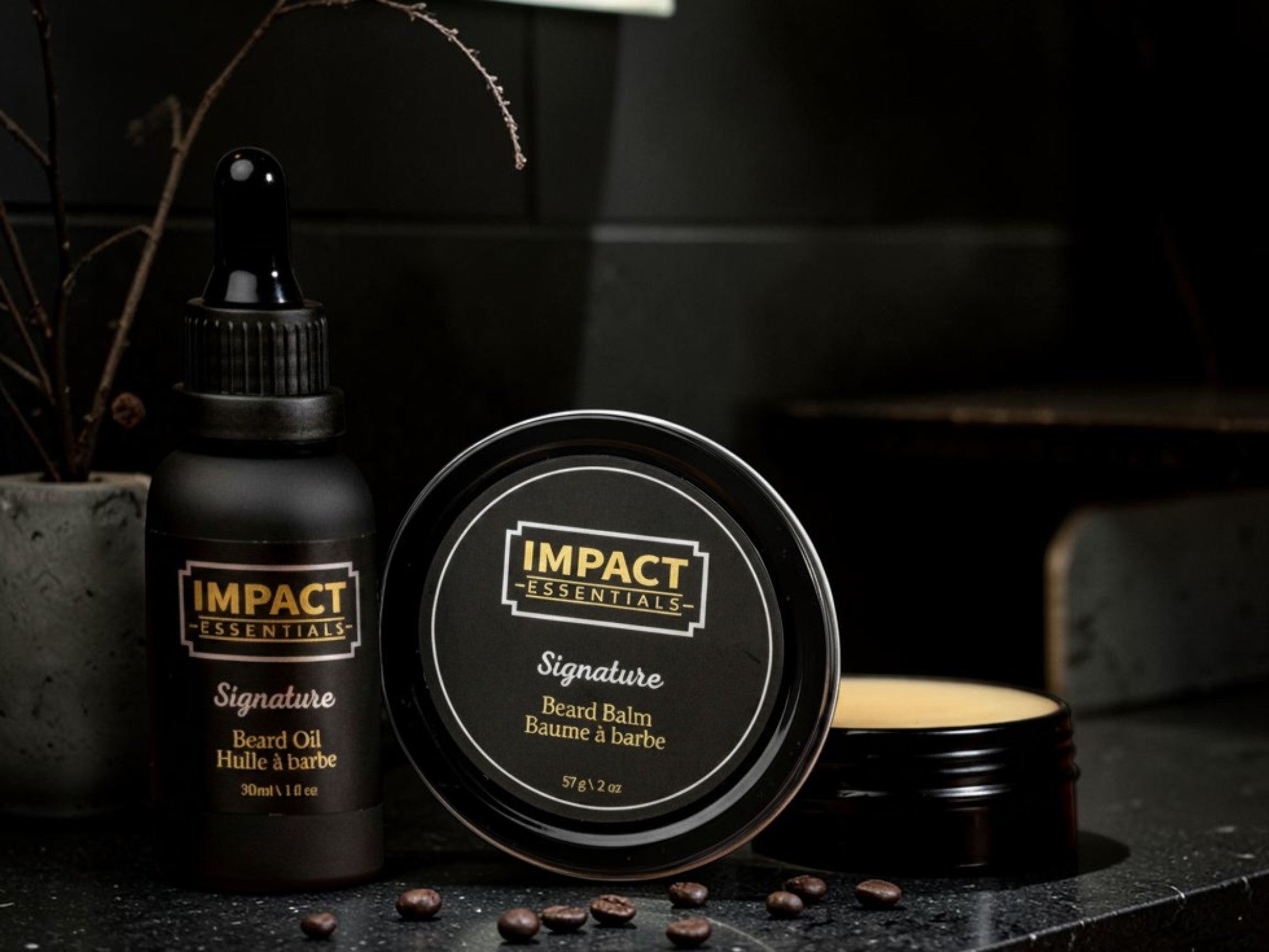 A beginner-friendly grooming kit from IMPACT Essentials laid out on a dark, rustic wood background.