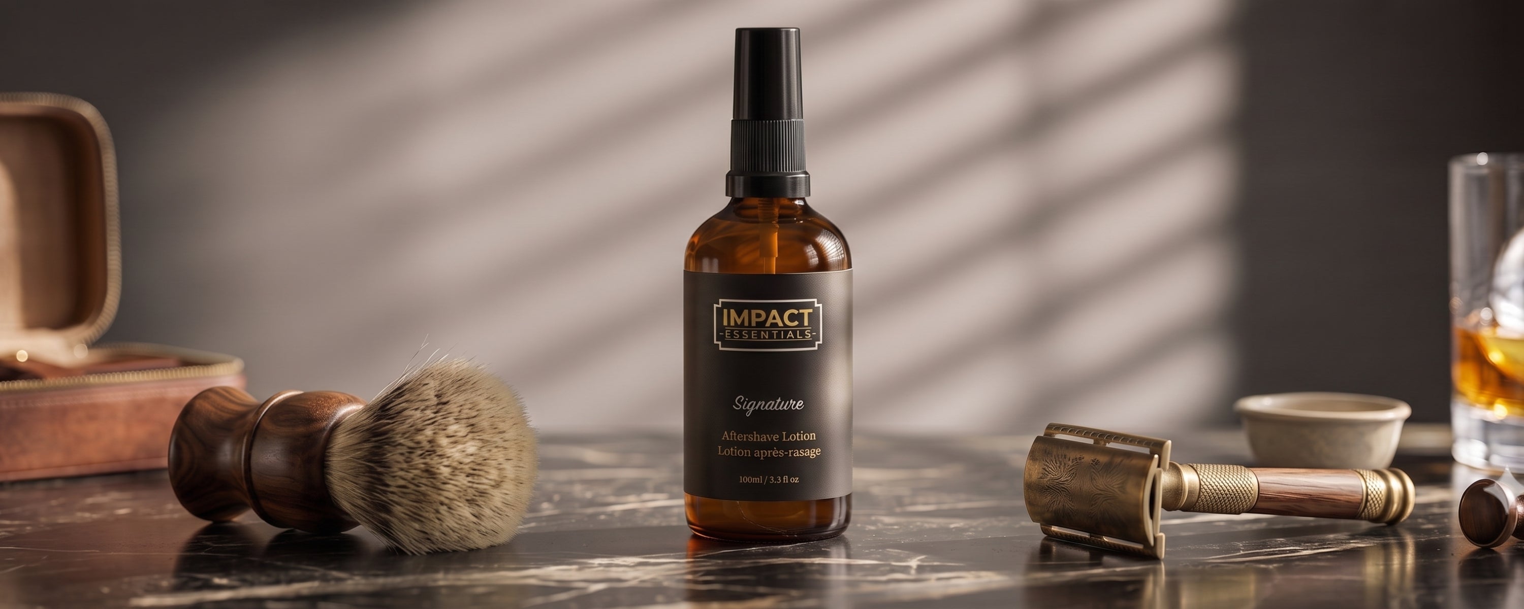 A bottle of Impact Aftershave lotion stands on a dark tabletop, surrounded by shaving props including a brush, a metal rasp, and a glass of amber liquid, under dramatic diagonal light shadows.