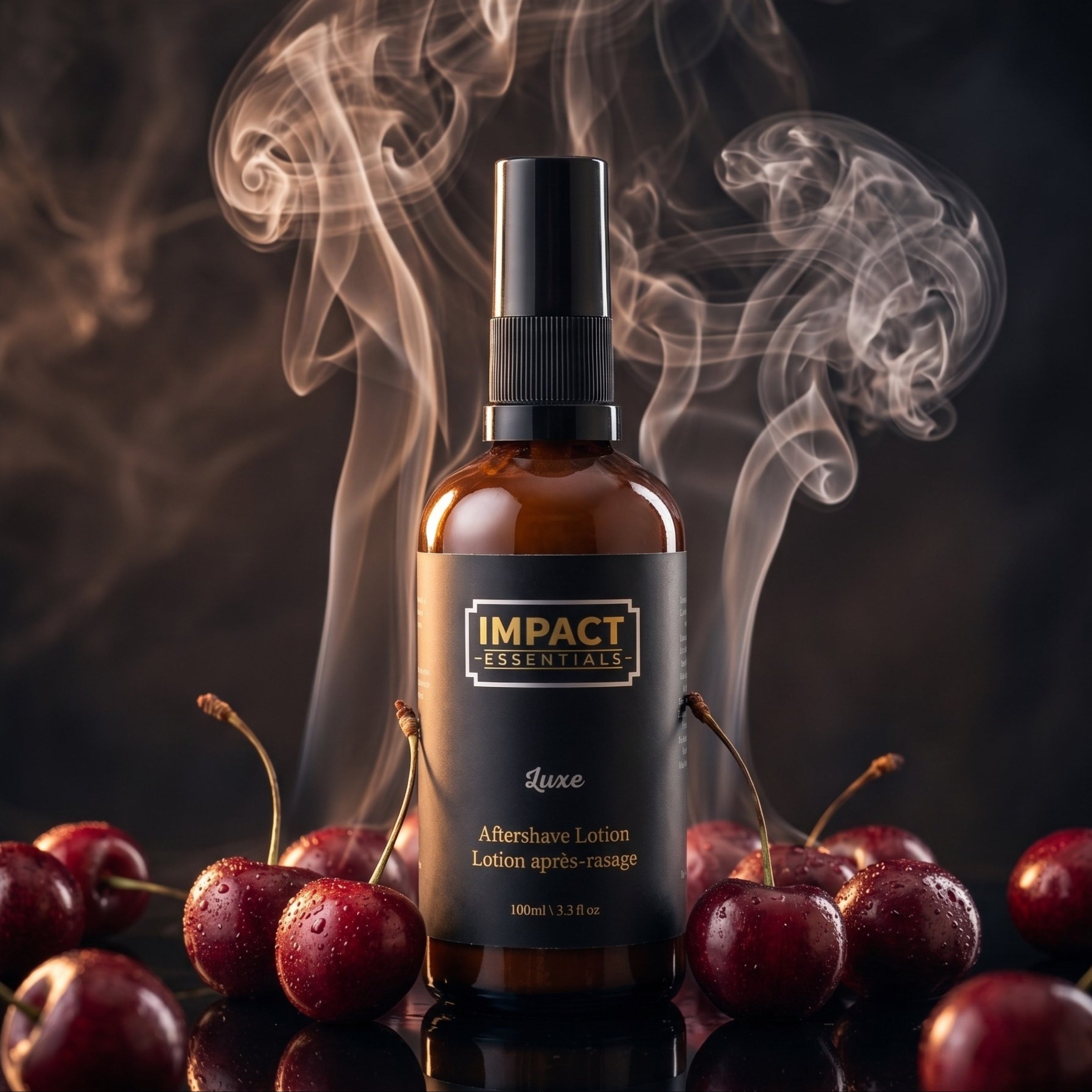 An amber glass spray bottle labeled 'IMPACT ESSENTIALs Luxe' with a black pump, surrounded by glossy red cherries and dramatic smoke on a dark background.